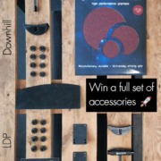 Accessories contest to celebrate our updated footstops. All accessories laid flat across a wooden pallet table